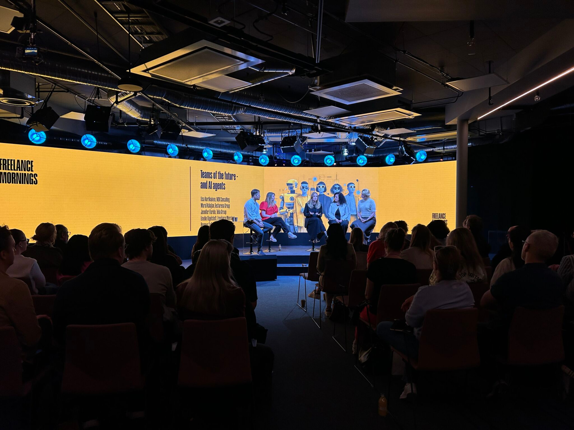 The Freelance Mornings panel on stage with the audience in front